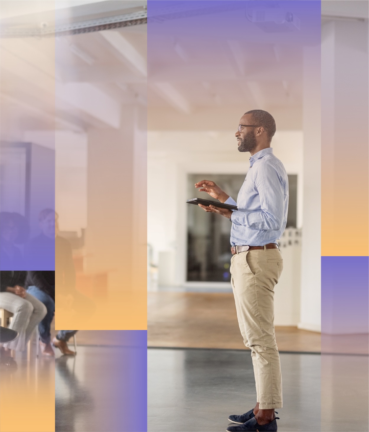 A person stands in a modern office space holding a tablet, presenting or reviewing information, with seated colleagues visible in the background and soft geometric color overlays layered across the image.