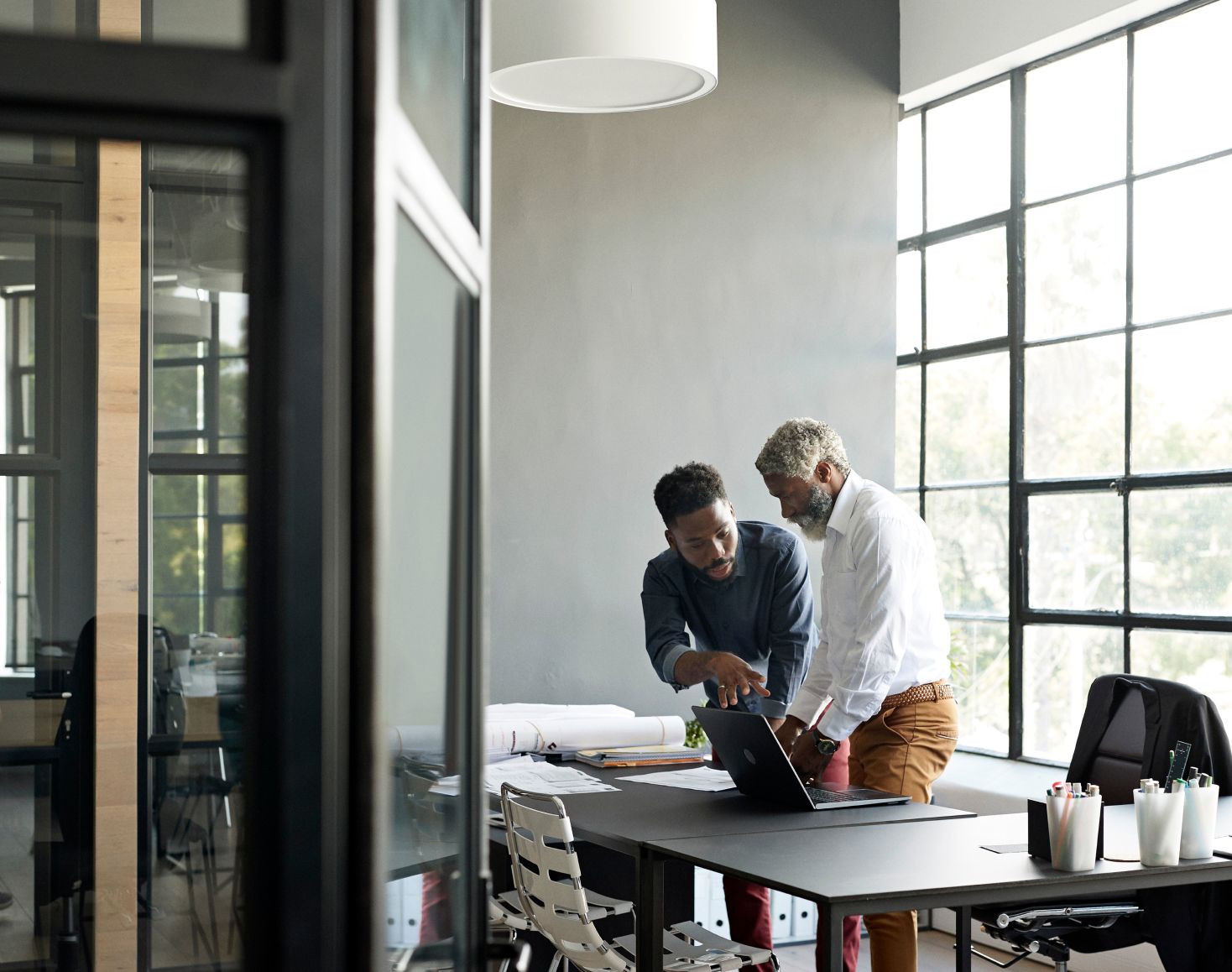 Two men discussing business during a meeting