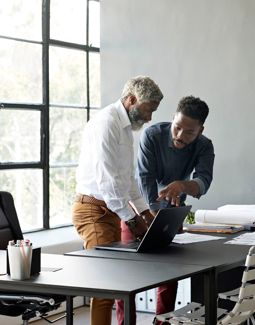 Two men discussing business during a meeting